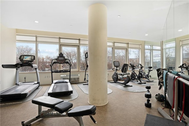 exercise room with light carpet and recessed lighting