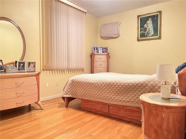 bedroom with light hardwood / wood-style floors