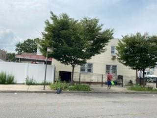 view of front of house featuring fence