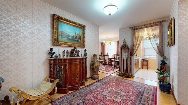 hall featuring a chandelier and hardwood / wood-style flooring