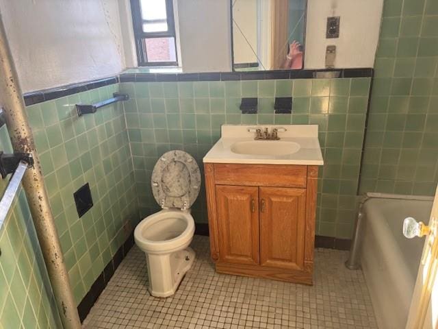 full bathroom featuring tile walls, tile patterned flooring, vanity, plus walk in shower, and toilet