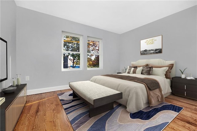 bedroom with hardwood / wood-style floors