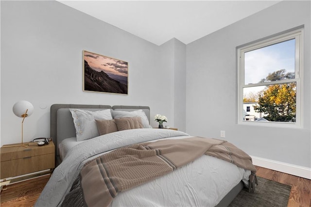 bedroom featuring dark wood-type flooring