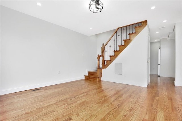 unfurnished living room featuring light hardwood / wood-style flooring