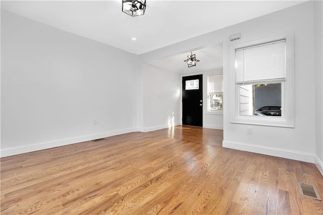 entrance foyer with light hardwood / wood-style flooring