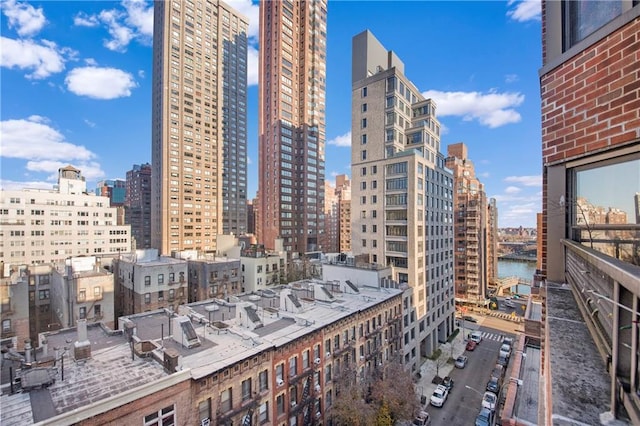 property's view of city featuring a water view