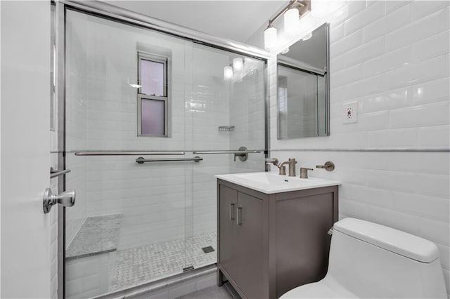 bathroom with vanity, toilet, and walk in shower