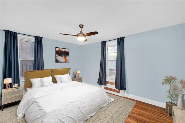 bedroom featuring hardwood / wood-style flooring and ceiling fan