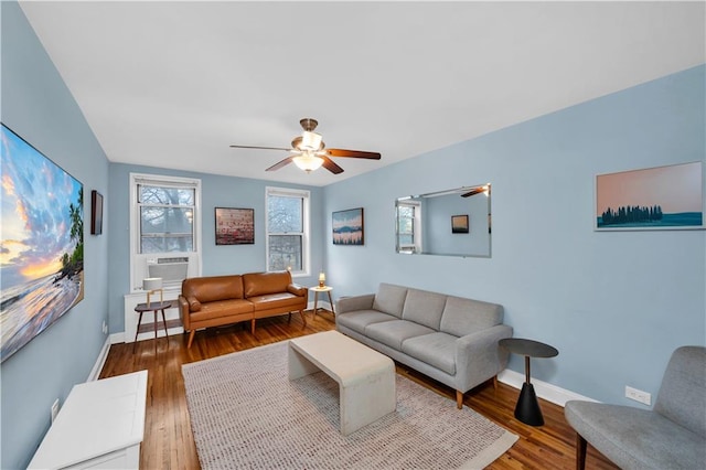 living room with cooling unit, hardwood / wood-style floors, plenty of natural light, and ceiling fan