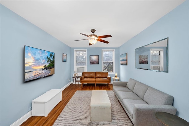 living room with hardwood / wood-style flooring and ceiling fan