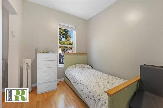 bedroom with light wood finished floors