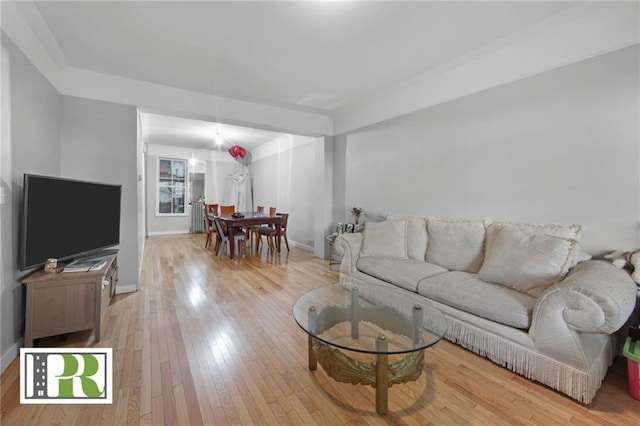 living room with light wood-style floors and baseboards