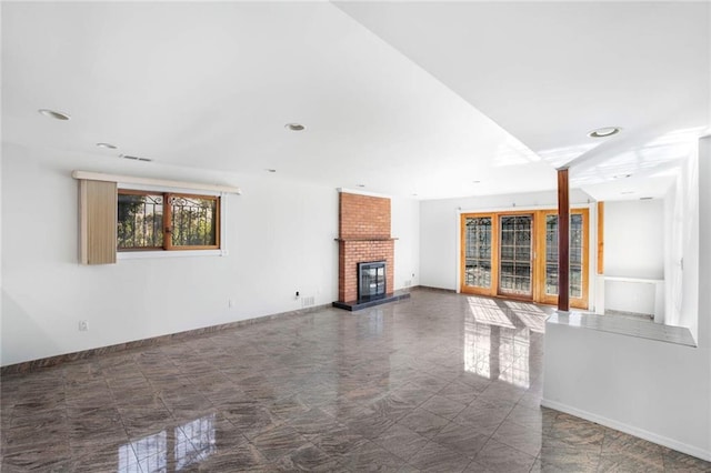 unfurnished living room with a brick fireplace