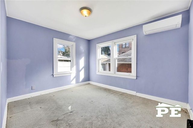 carpeted spare room featuring an AC wall unit