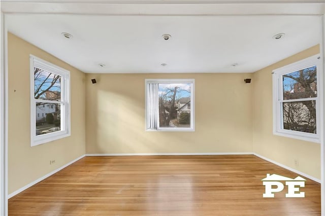 unfurnished room featuring light hardwood / wood-style floors