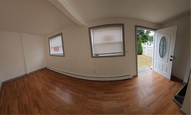 entrance foyer featuring hardwood / wood-style flooring, a baseboard heating unit, and washer / clothes dryer