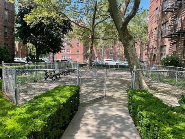 view of property's community featuring fence