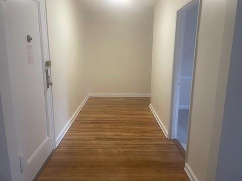 hallway featuring hardwood / wood-style flooring