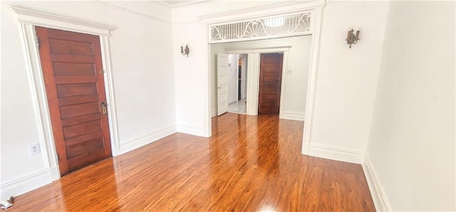 unfurnished room featuring hardwood / wood-style flooring