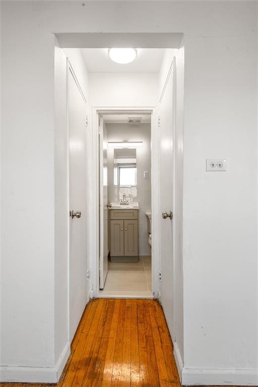 2035 E 7th St Unit 5F, Brooklyn, NY 11223 - hallway with light wood-style flooring and a sink
