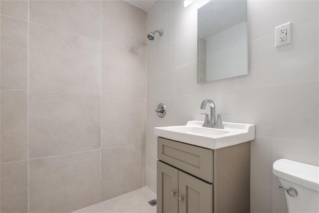 2035 E 7th St Unit 5F, Brooklyn, NY 11223 - bathroom featuring tile walls, vanity, and tiled shower