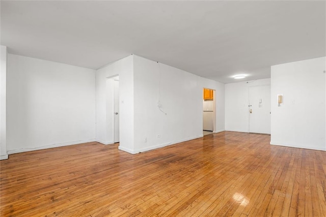 2035 E 7th St Unit 5F, Brooklyn, NY 11223 - empty room with light wood finished floors and baseboards