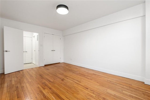 unfurnished bedroom with light wood-type flooring