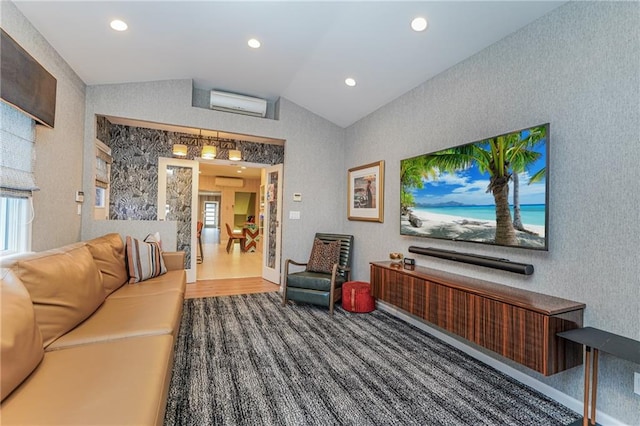 living area featuring lofted ceiling, plenty of natural light, recessed lighting, and a wall mounted AC