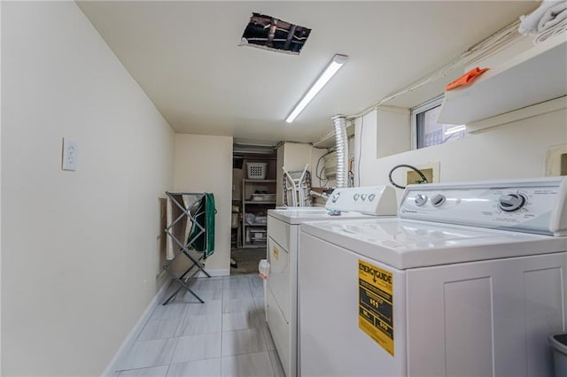 1469 E 5th St, Brooklyn, NY 11230 - laundry area with washing machine and clothes dryer and baseboards