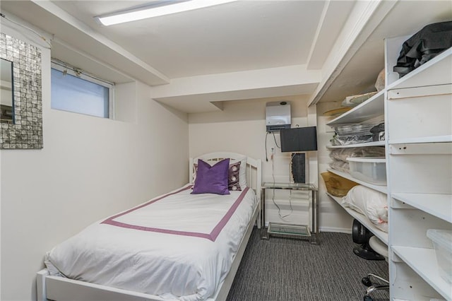 bedroom featuring dark colored carpet