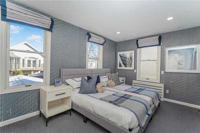 bedroom with wallpapered walls, carpet, and baseboards