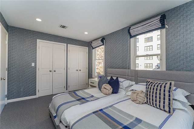 1469 E 5th St, Brooklyn, NY 11230 - carpeted bedroom featuring two closets, wallpapered walls, recessed lighting, and baseboards