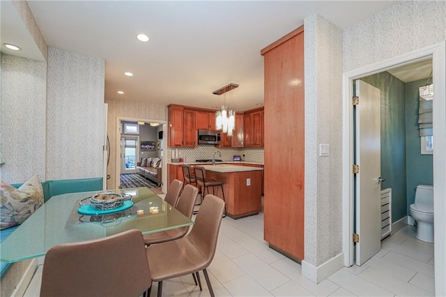 1469 E 5th St, Brooklyn, NY 11230 - dining room featuring wallpapered walls, light tile patterned flooring, recessed lighting, and baseboards