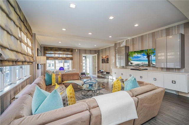 living room featuring wallpapered walls, ornamental molding, dark wood-style flooring, and recessed lighting