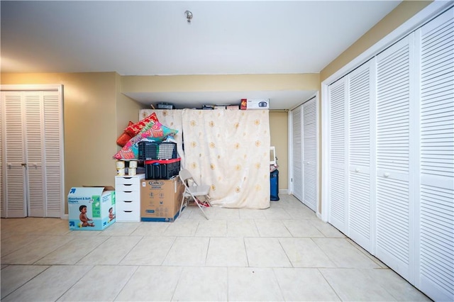 unfurnished bedroom featuring tile patterned floors