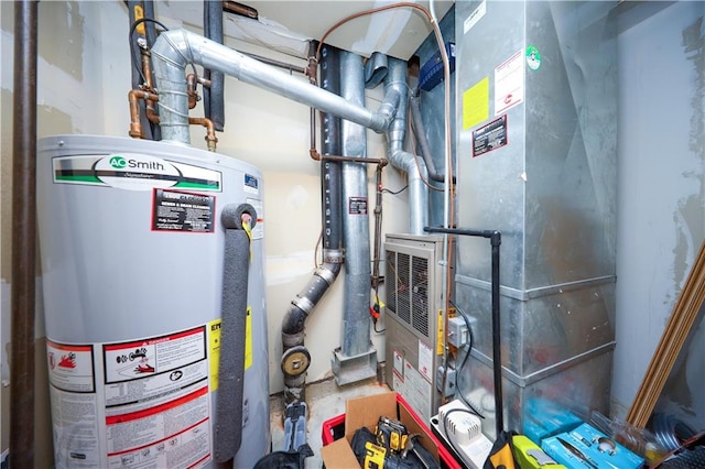 utility room with heating unit and water heater