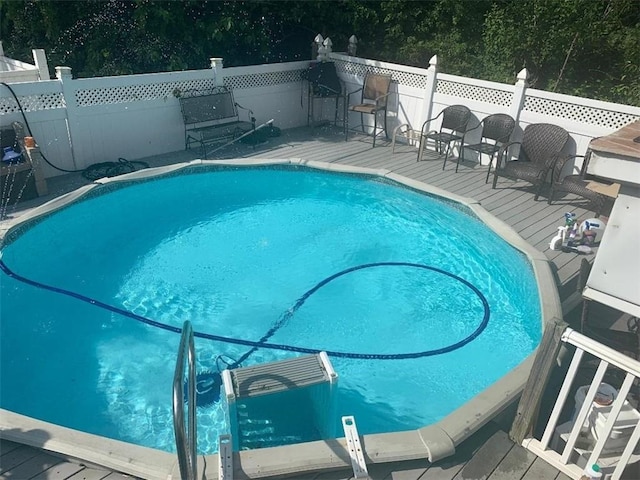 view of pool with a wooden deck