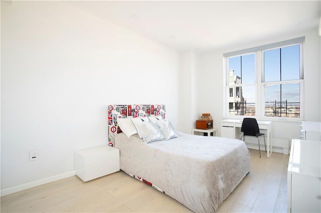 bedroom with light hardwood / wood-style flooring