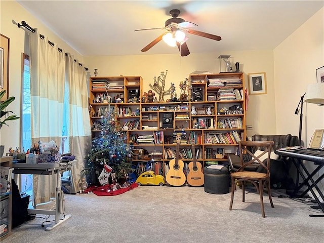 interior space featuring carpet flooring and ceiling fan