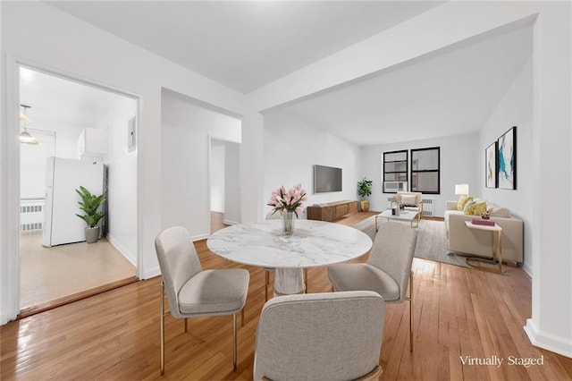 dining space featuring light hardwood / wood-style flooring