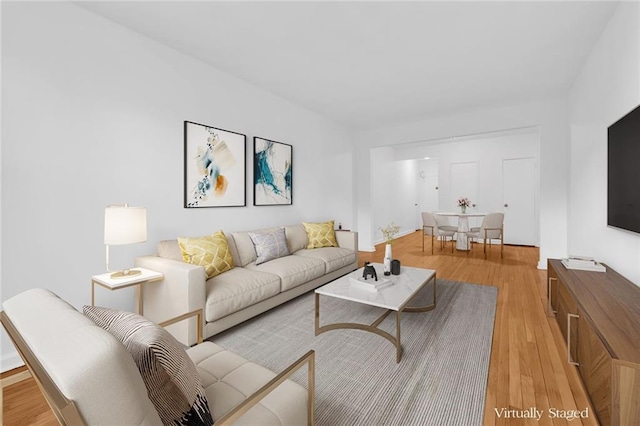 living room with light hardwood / wood-style flooring