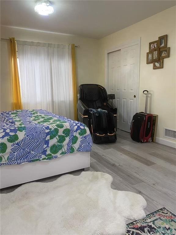 bedroom featuring a closet and hardwood / wood-style flooring