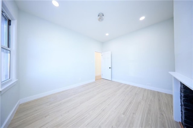 interior space with recessed lighting, baseboards, and wood finished floors