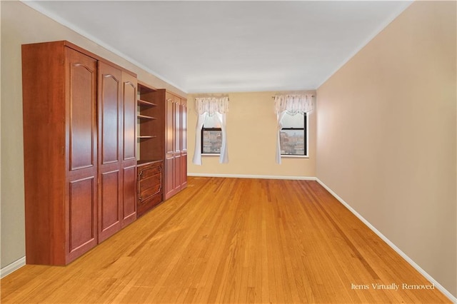 unfurnished living room with light hardwood / wood-style flooring