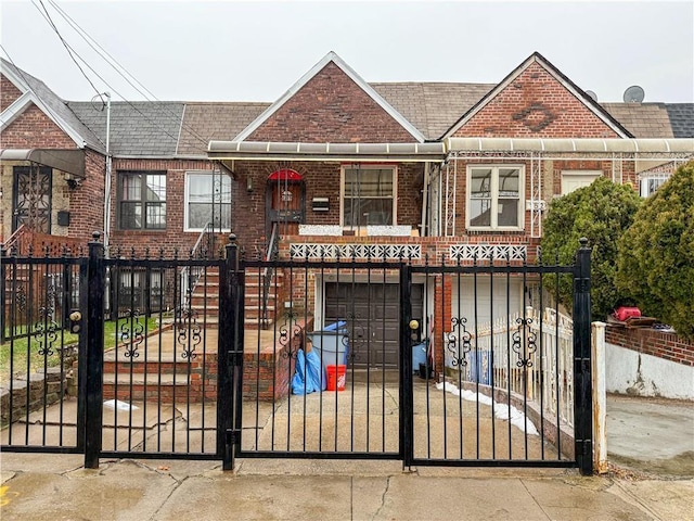 view of gate featuring a garage