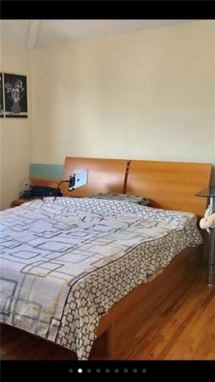 bedroom with wood finished floors