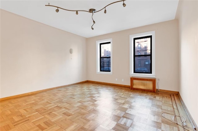 unfurnished room featuring light parquet flooring