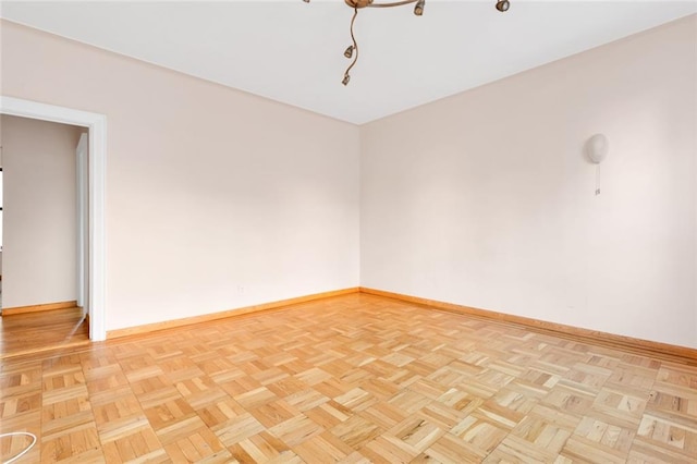 unfurnished room featuring light parquet floors