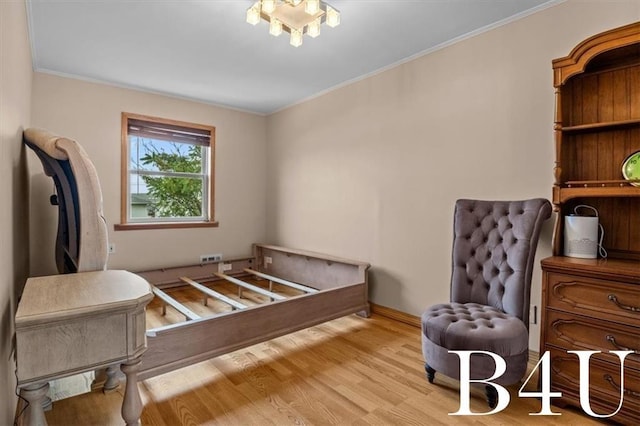 bedroom with crown molding, baseboards, and wood finished floors