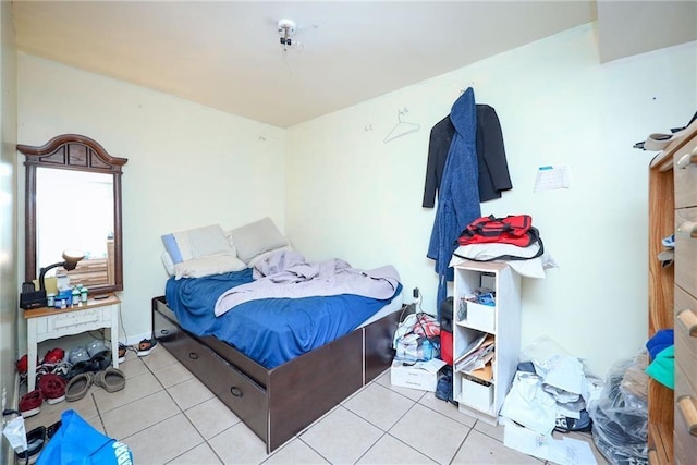 bedroom featuring light tile patterned flooring